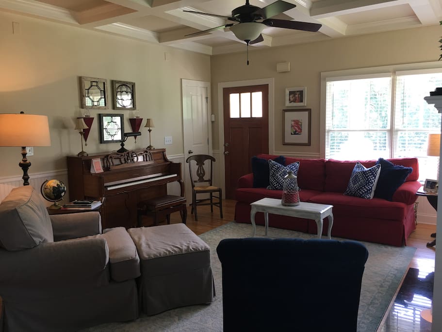 Cozy living room. Red sofa can be used as twin bed with back cushions removed. Many of our family's guests have rested easy and comfortably on this sofa.