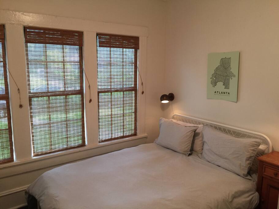 Bedroom 1: Comfortable queen bed in a bright modern room