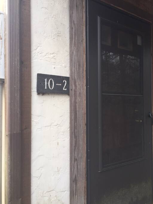 Front door of Apartment has sign "Welcome to AirBNB"