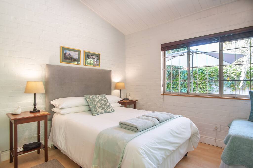 The studio comfortably sleeps 2 adults and 2 children (1 child, 1 infant). The extra room next door is not inter- leading so is better for 1 or 2 adults.