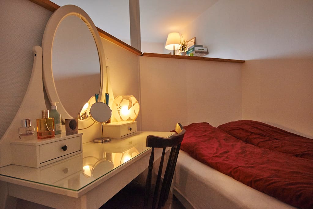 Bedroom area with a vanity table