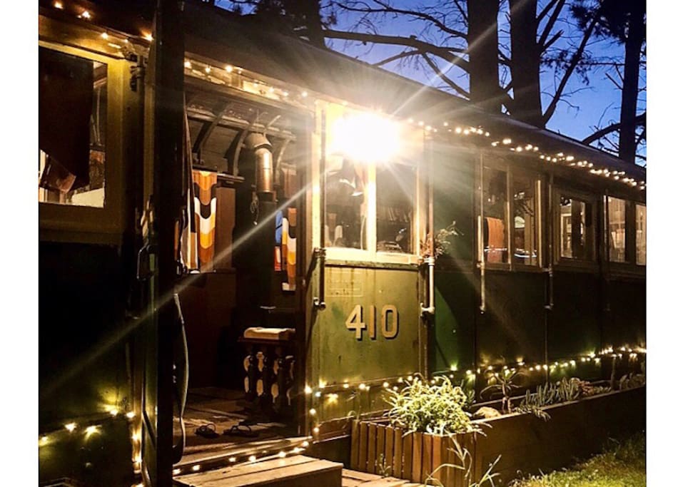 The tram lit up at night
