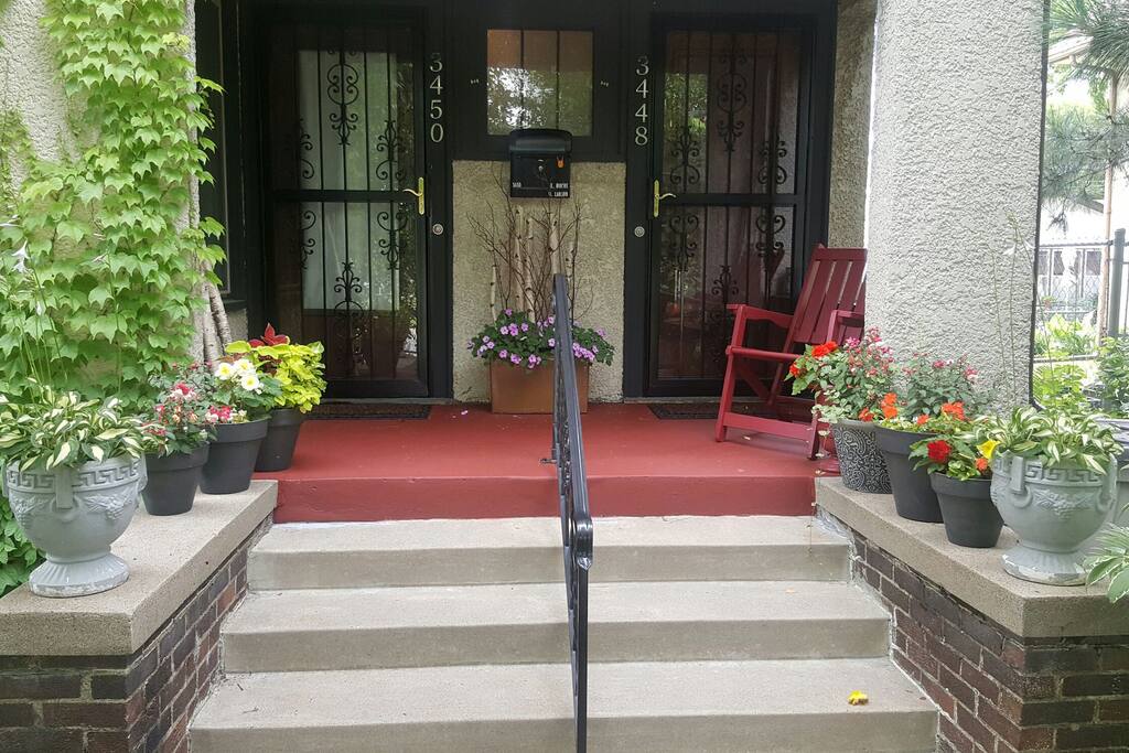 View of the front door and steps. We live at 3448 on the right. Your access is 3450 on the left.