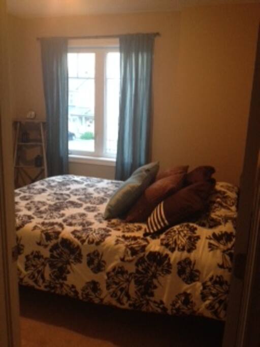 Second upstairs bedroom with a queen bed.