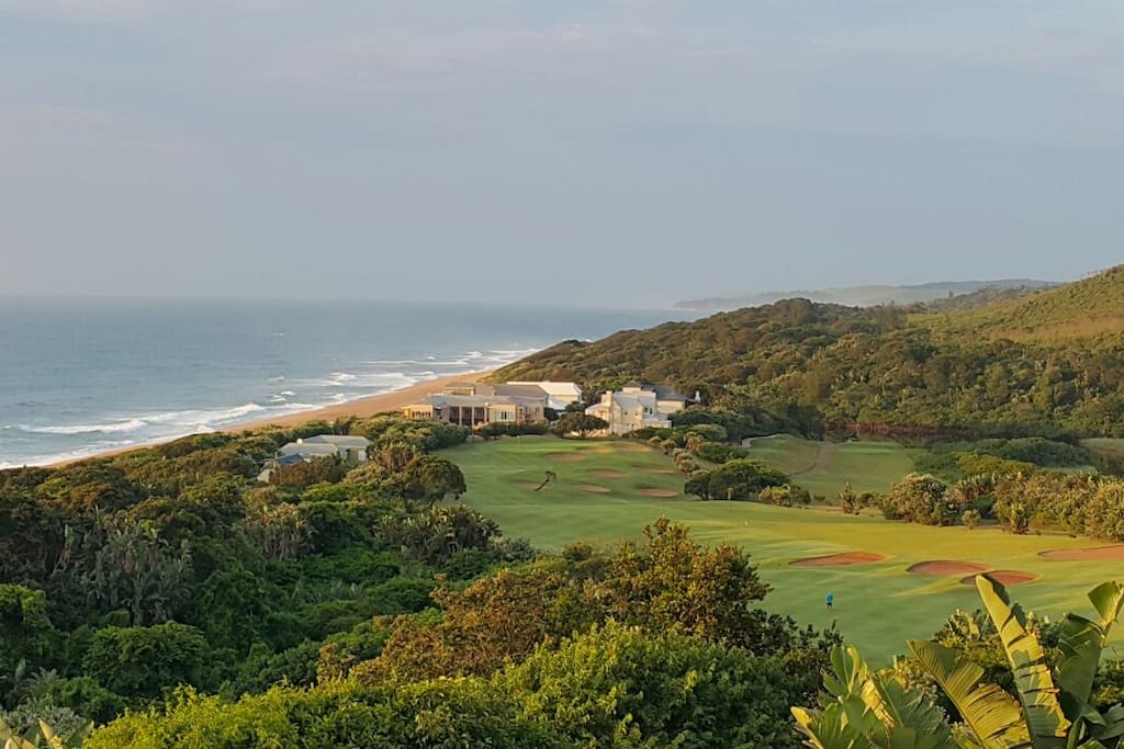 The cottage is one of the buildings at the end of the tee
