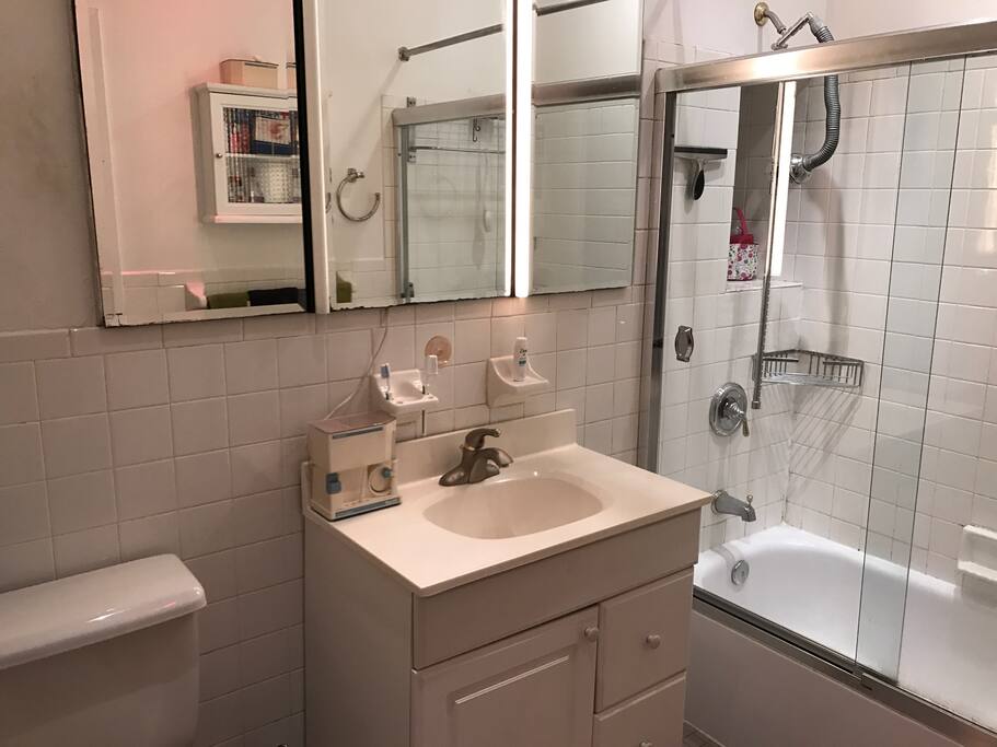 Bathroom a sink, shower toilet