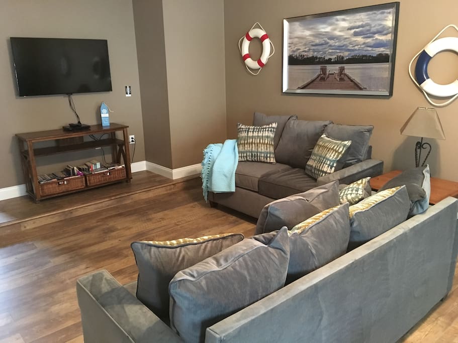 Large first floor family room with flat screen TV and game room