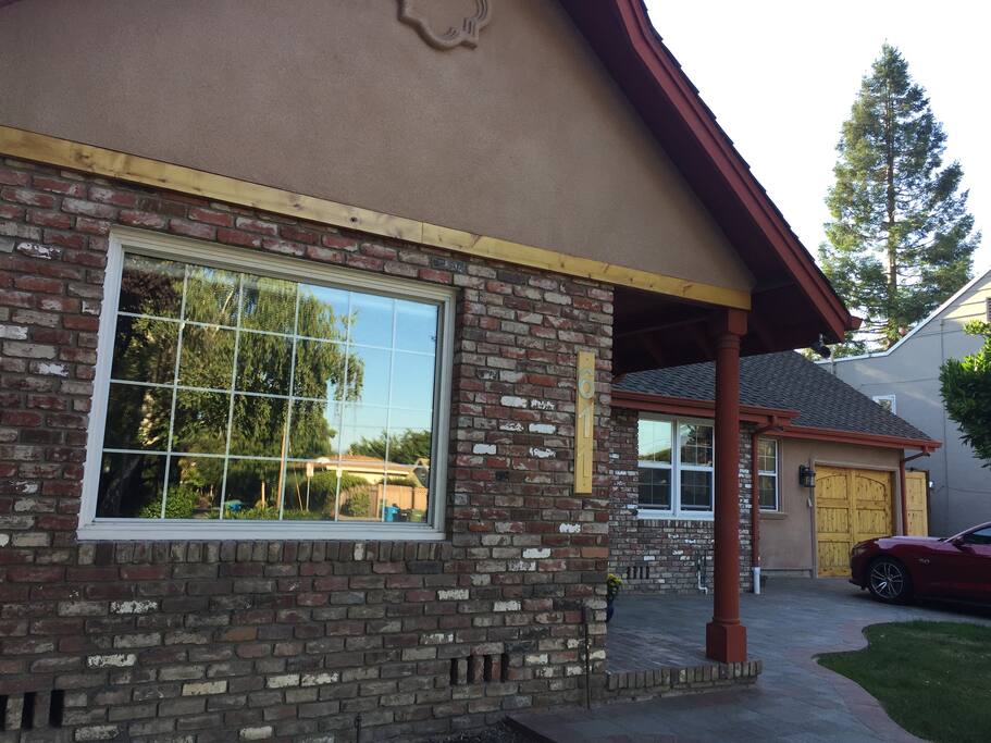 The home's exterior. Guests access a rear entrance (via courtyard gate) to their fully private residential guest home