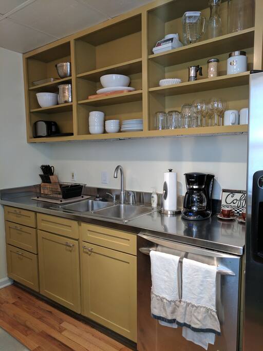 Our kitchen is fully stocked to cook, host and dine! Our guests will enjoy access to some basic cooking spices, oils, vinegars and ground coffee. Plates, flatware, glasses, prep materials, bowls and serving utensils have been organized for you. A large sink, dish washer and standard refrigerator are available.
