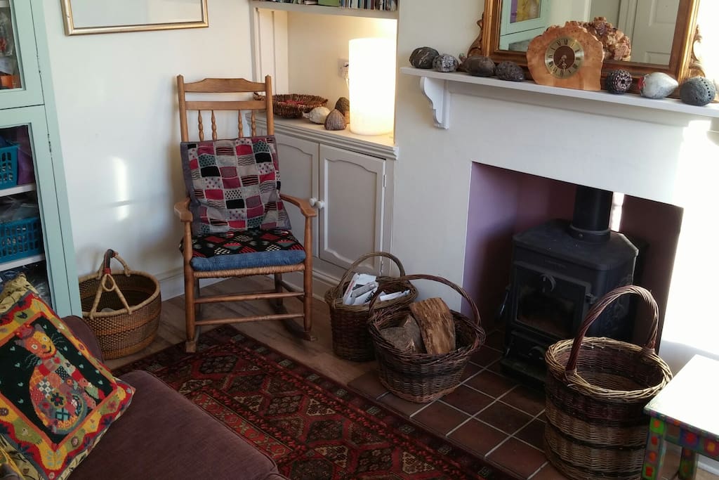 Comfortable front room with Cathedral view. Wood burning stove is lit in winter.