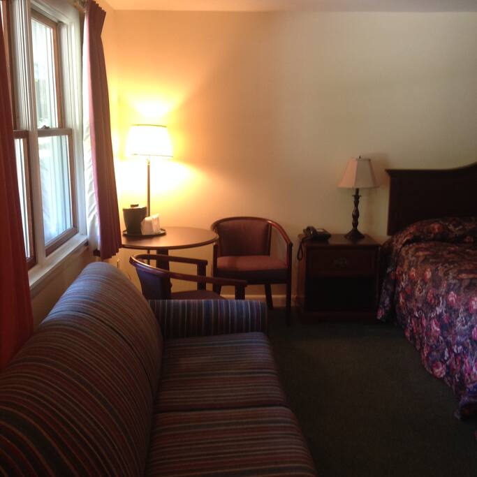 This room has a king size bed and a pullout double sofa