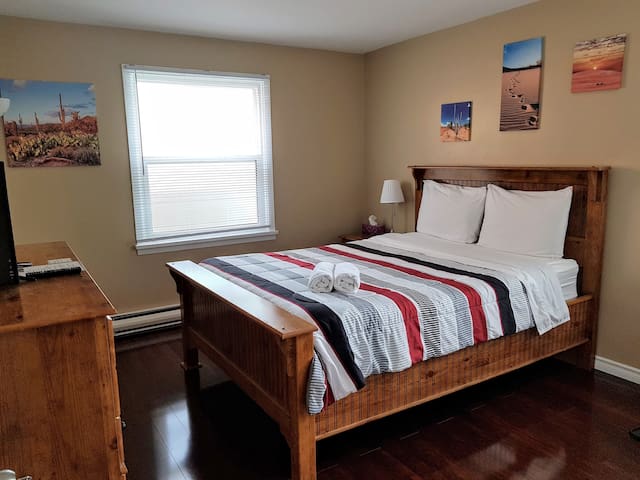 Wind Down on this Comfy Queen Bed near the Falls!