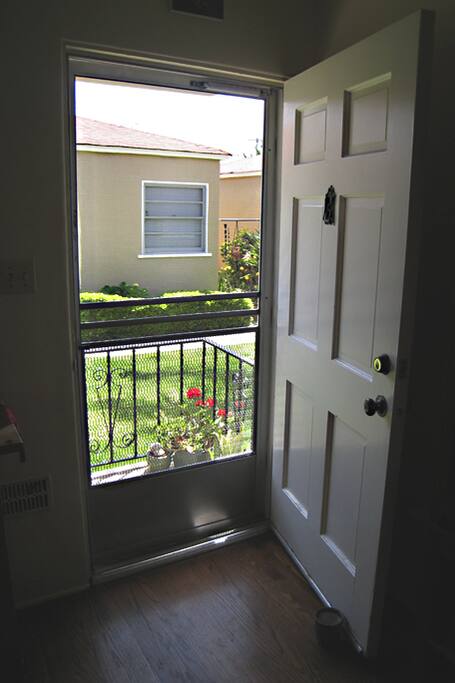 View looking out front door of cottage