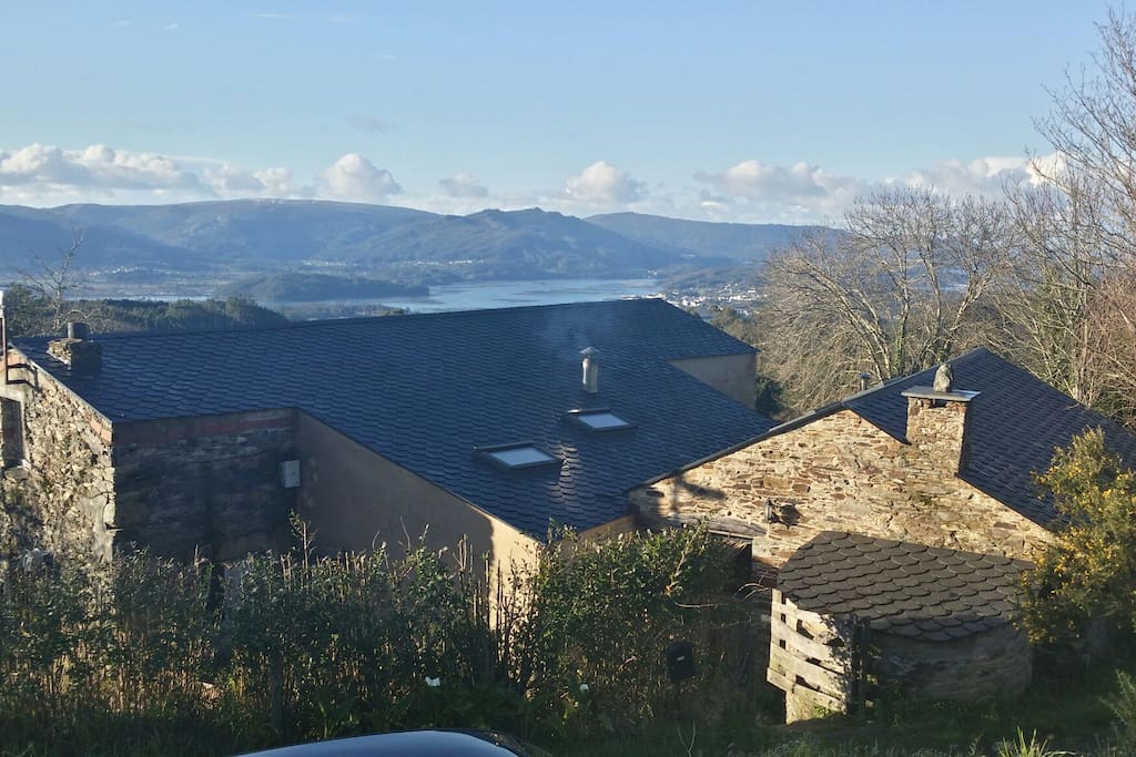 Overview of whole property with views in the background.