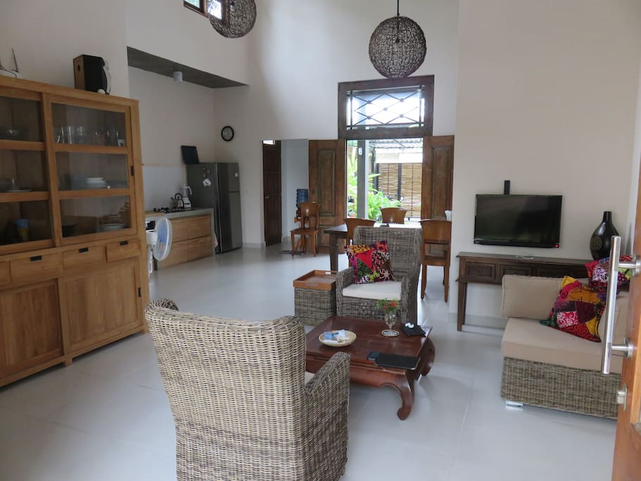 Inside the villa, high ceilings and open doors on either side for good air ventilation.