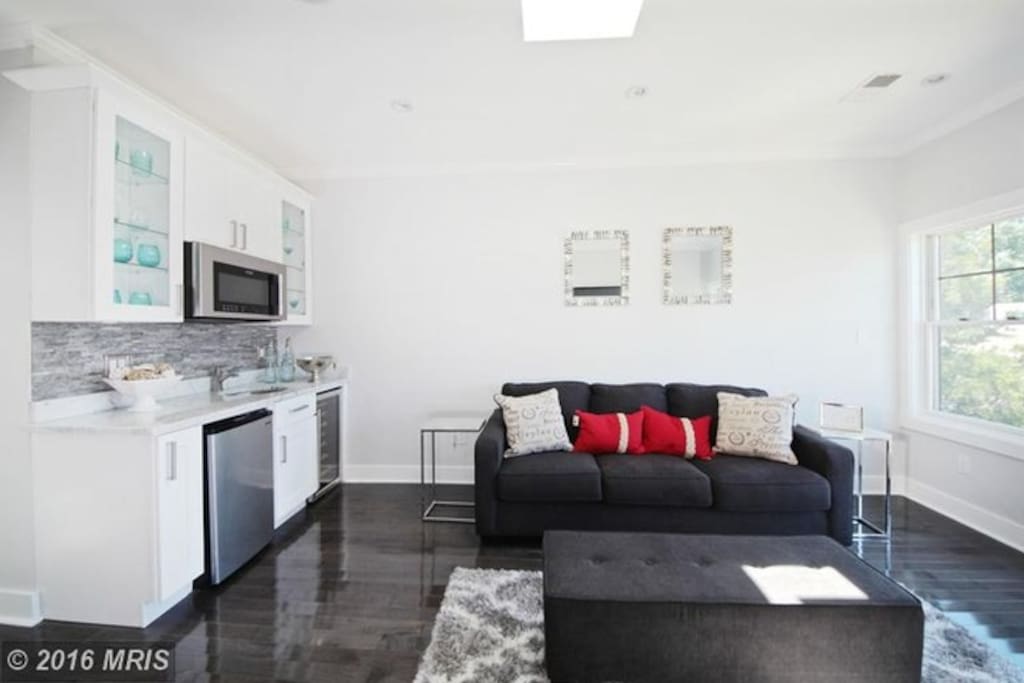 Cozy up with a movie and popcorn in your own master suite living room with wet bar and 60 inch TV