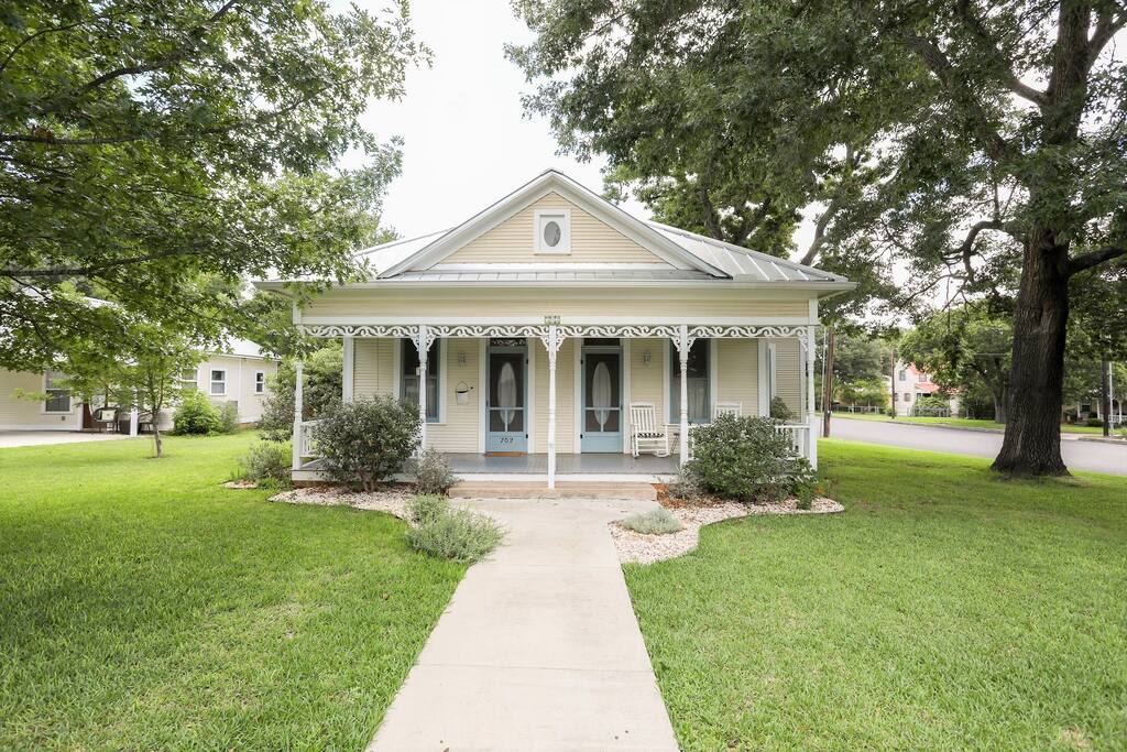 Bright and beautiful historical exterior with intricate gingerbread detailing