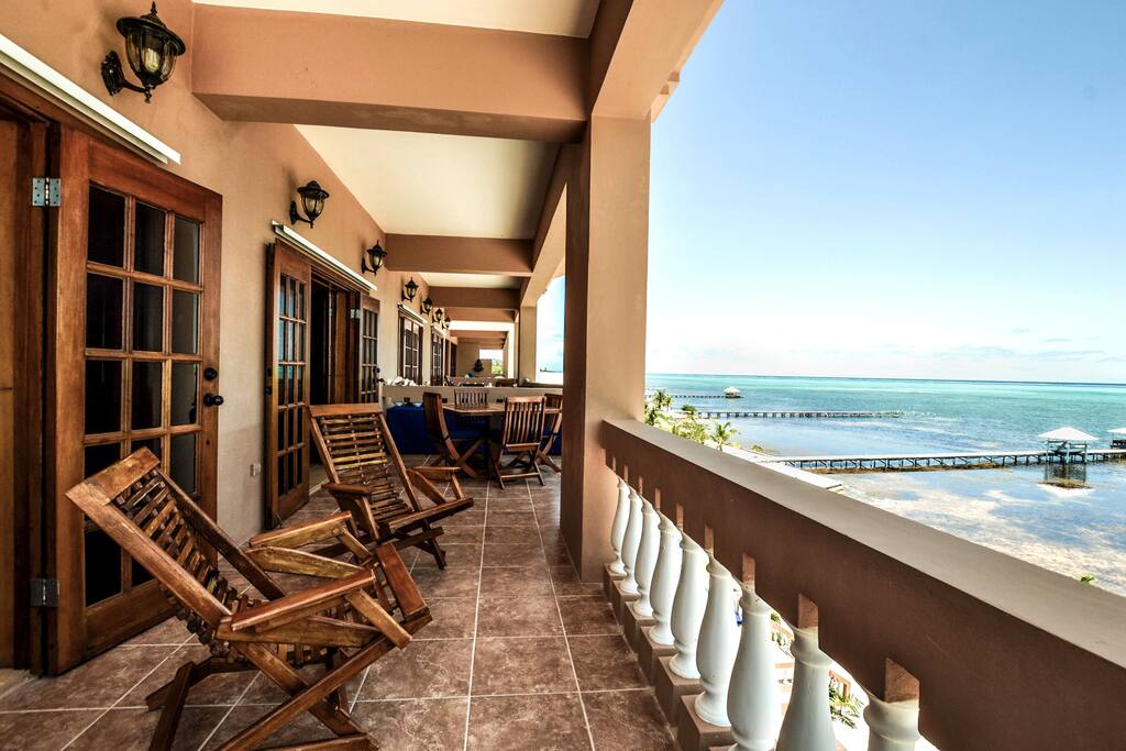 Spacious balcony contains both living AND dining furniture!