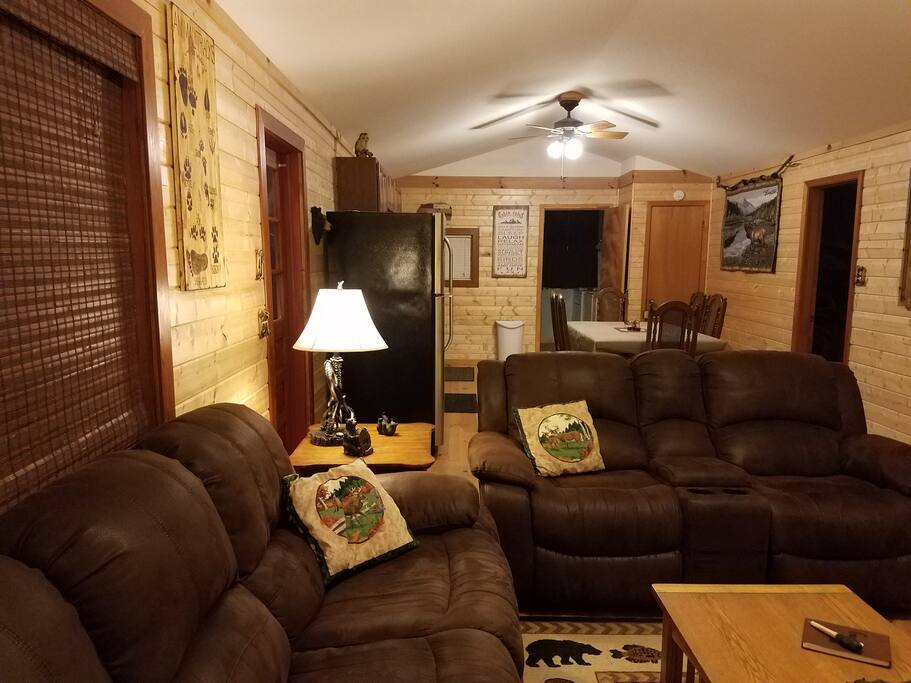 reclining couches in front of the fireplace