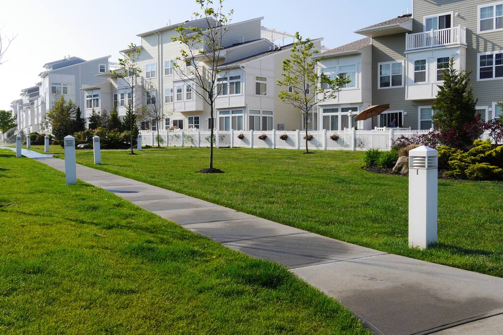 Landscaped park at the back of the house leading to the beach.