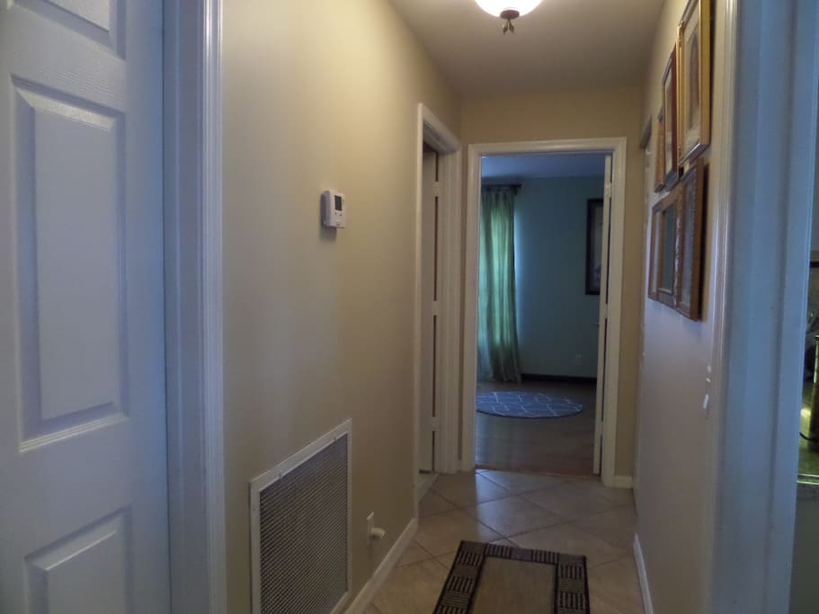 Hallway leading to bedroom and bath. Has pocket door for added privacy