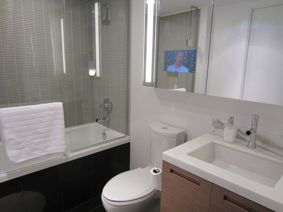 Italian marble counters with Tile Flooring and built-in TV
