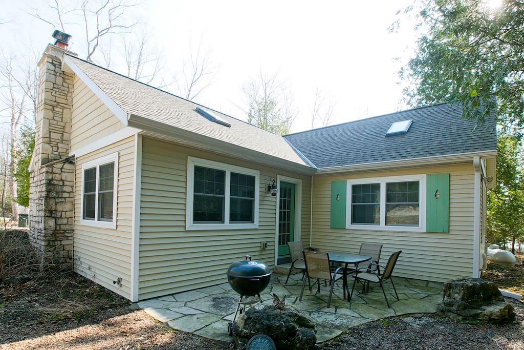 Arbor cottage also has a stone patio with a charcoal grill and fire pit