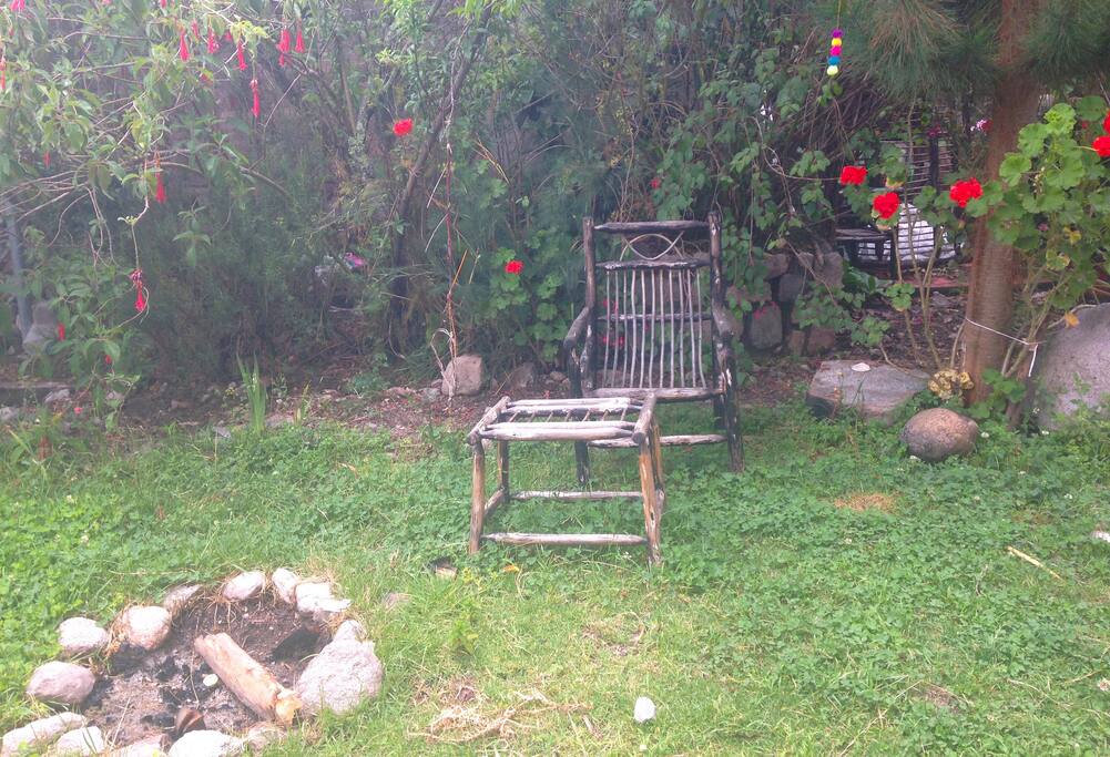 Relaxing garden full of hummingbirds, and surrounded by the serene sound of running water
