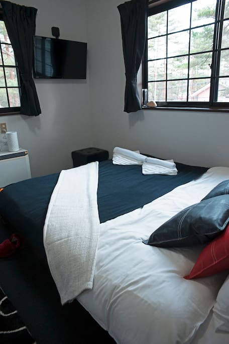 Queen bed with Apple TV