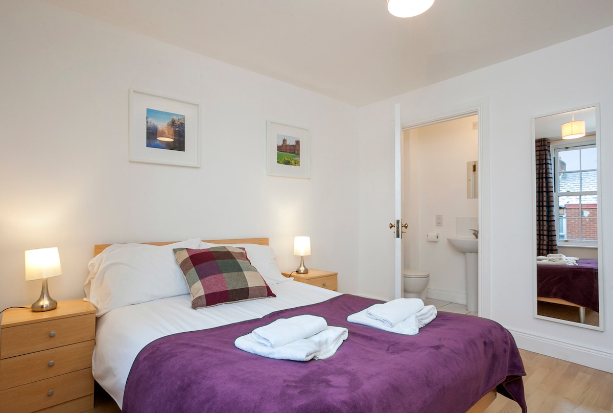 Bedroom 1 with double bed and ensuite shower room