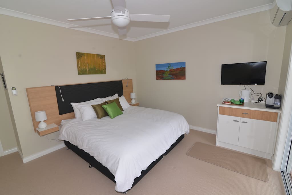Watch the sun rise and the moon come up snuggled in bed in the Marri Room.