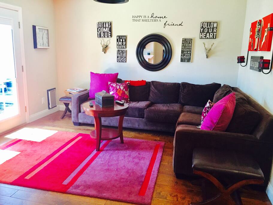 Huge living room with sectional couch and French doors to private yard and patio.