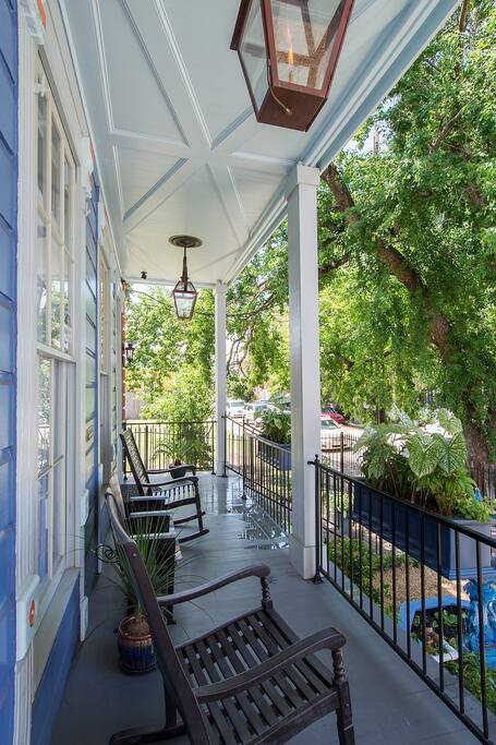 The front porch features authentic gas lanterns