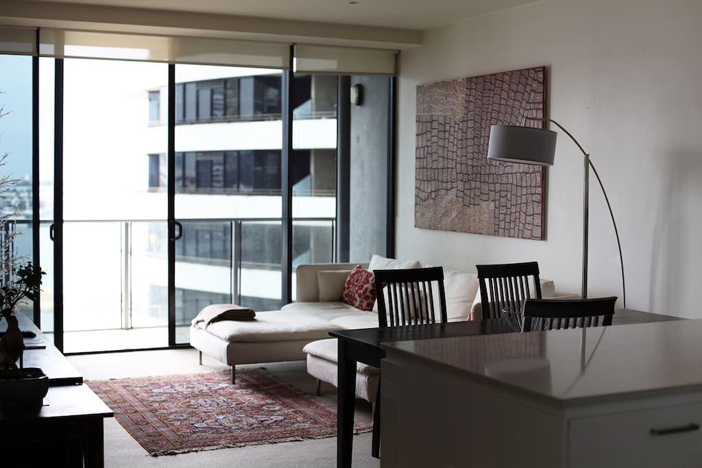 Open plan kitchen and living room faces on to the water.