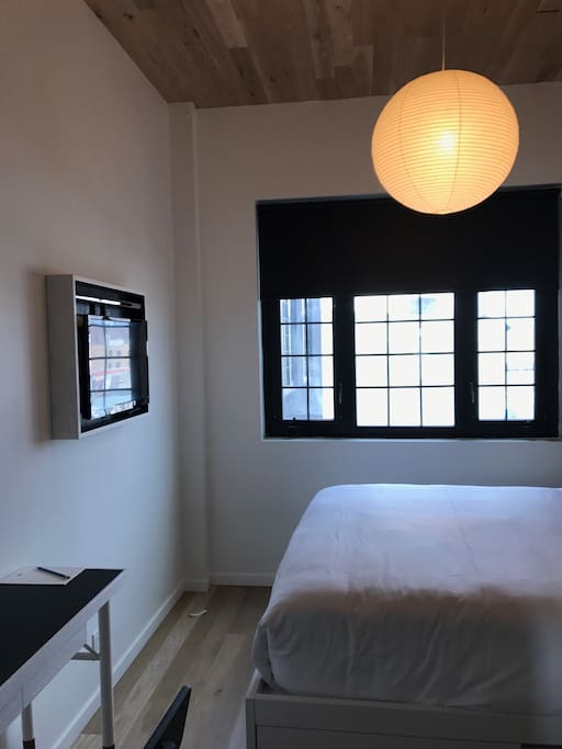 Flatscreen TV and Desk In Room
