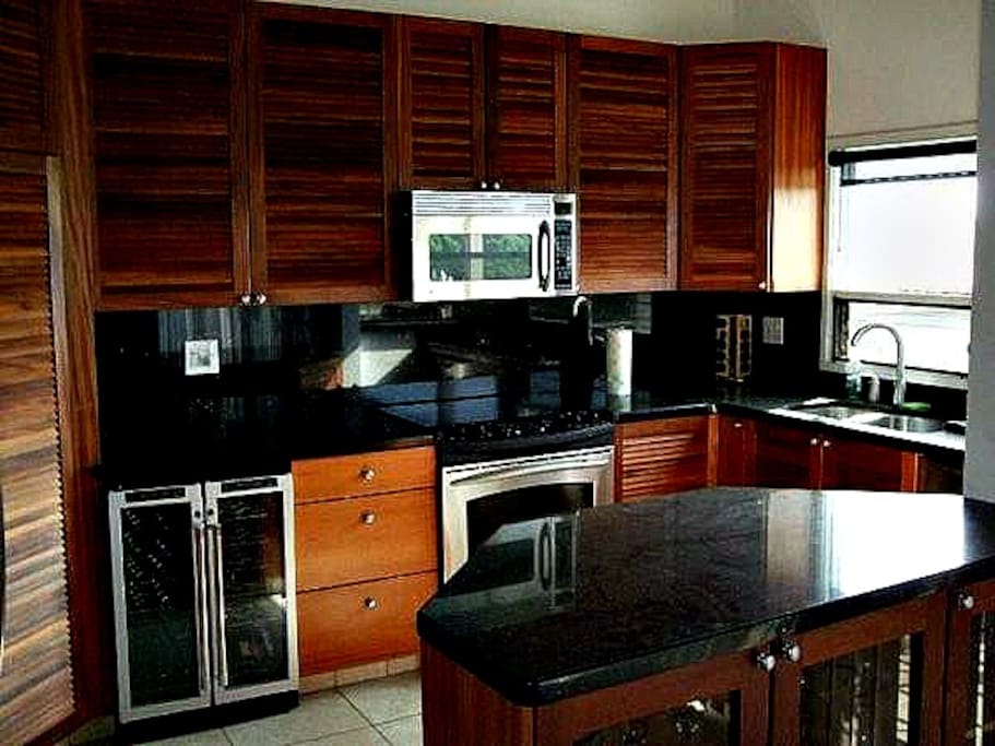Another View of Kitchen with Black Granite Counters and African Mahogany Cabinets