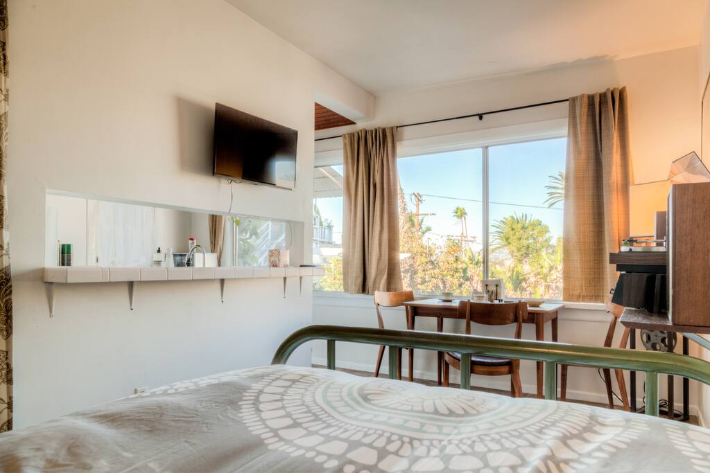 looking towards the lovely view and kitchen area. The TV is on a swivel mount and connects to Wi-Fi.