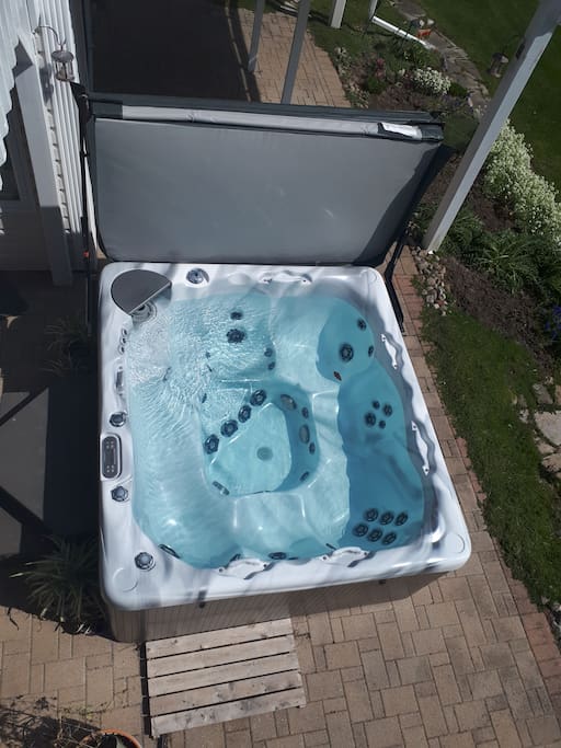 Enjoy a hot tub overlooking the forest