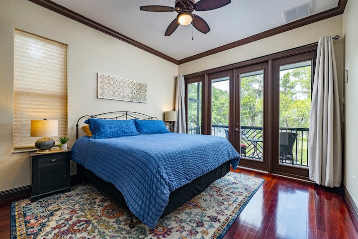 Second bedroom with comfortable king bed; includes access to second floor porch.