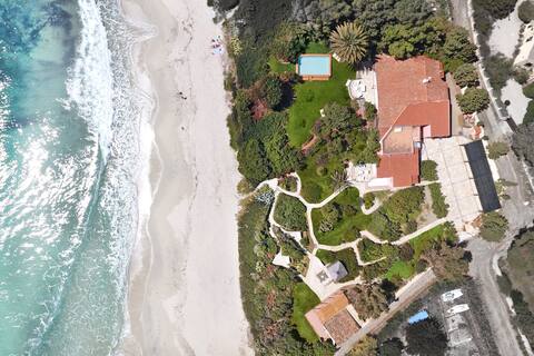 Beachside villa with pool and garden