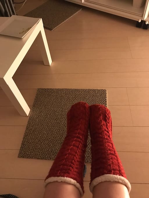 Wooden floor and carpet (of course red warm socks for rent if needed!)
