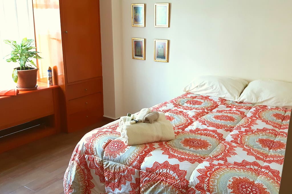 Sunny bedroom, comfy bed