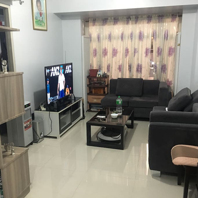 Living room with 50" TV with Cignal Cable service.