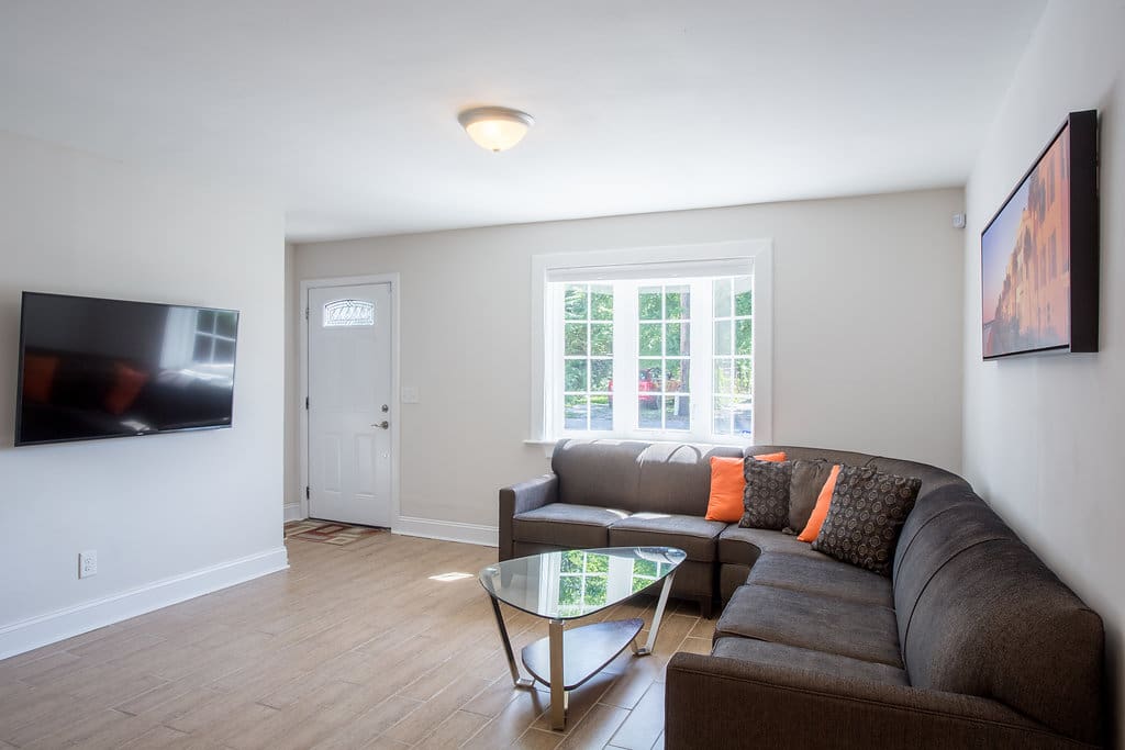Spacious Living Room with Big-Screen 4K HD Television and Comfortable Seating