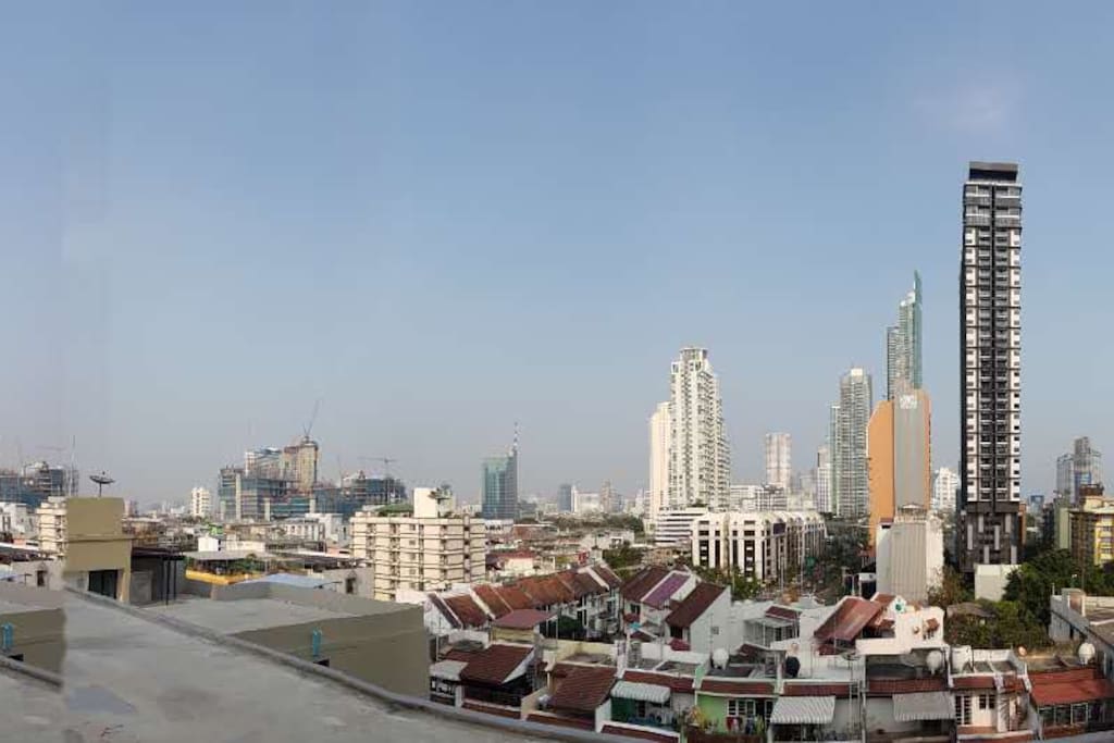 View from rooftop towards city. Tall gray/white building is where I live.