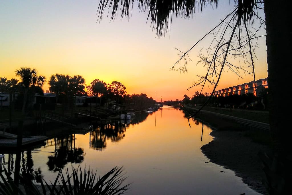 Sunrise from your private floating dock where sailboats bob in the kiss of the Gulf Breeze.
