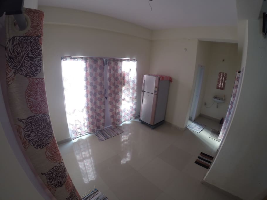 Hallway between living room, kitchen and other rooms.