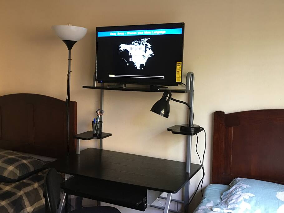 HDTV and Writing desk in room