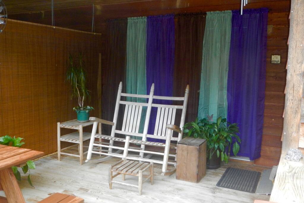 Private porch with picnic table.