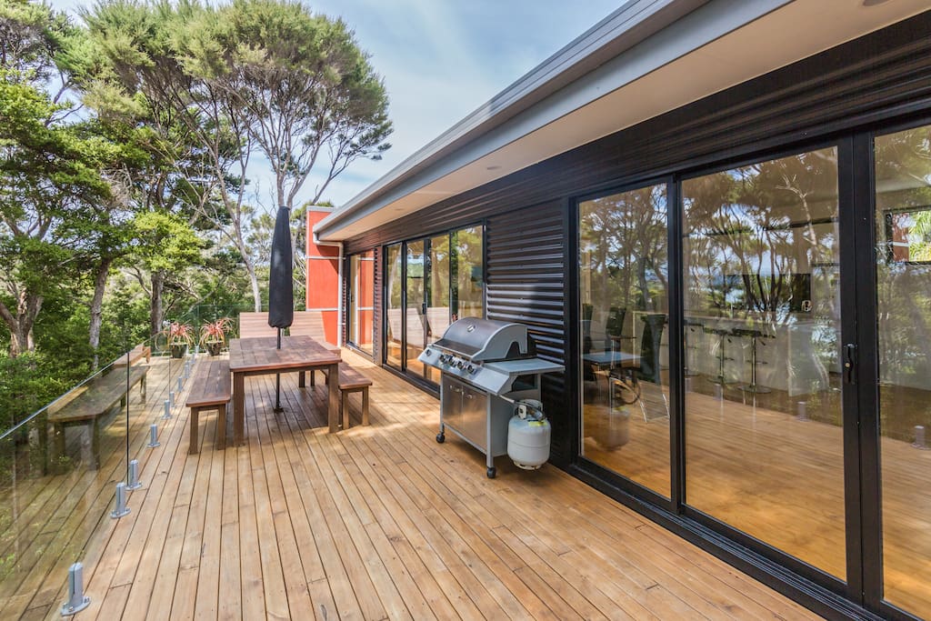 Deck, BBQ, Outdoor dining, over looking the bay/beach, through native forest.